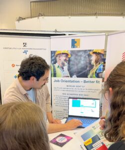 Job presentation for two young people at a job fair